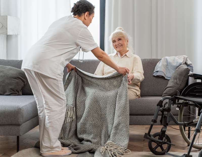 doctor-taking-care-senior-woman-home